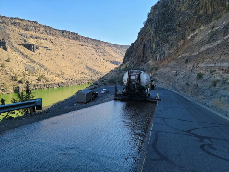 Chip Seal Truck putting Tarmac Road 